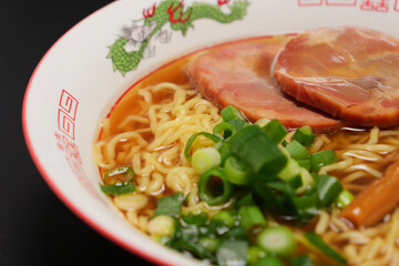 Soy sauce ramen noodles with grilled pork, bamboo shoots, and green onions, a noodle dish that has long been a favorite in Japan
