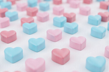 collection of heart shaped candies pastel pink blue colors