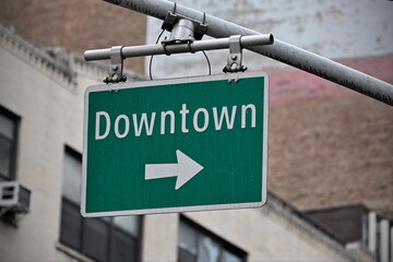 View of a city street sign reading downtown