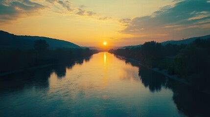 Obraz premium Sunset over calm river valley, idyllic landscape, peaceful evening scene, nature photography, travel