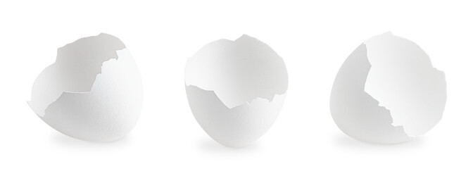 Three different broken fragile empty eggshell of chicken or hen isolated on white background is...