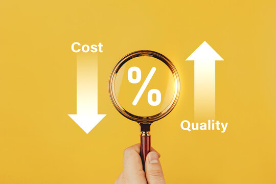 Businessman holds magnifying glass with percentage symbols and up and down graph. Concepts of marketing strategies, reducing costs, quality control, reducing product costs and increasing efficiency.