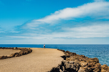 Spectacular view of Los Hervideros with dramatic coastline and vibrant sea looks on a clear day