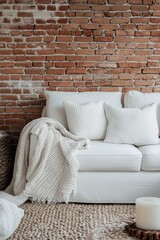 A cozy living room with a white sofa and throw blanket