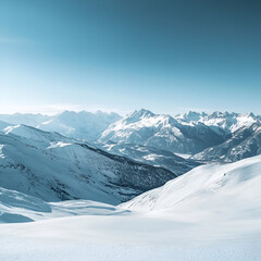 Obraz premium Winter Wonderland: A panoramic view of snow-capped mountains stretching out in all directions, bathed in the soft glow of the winter sun.