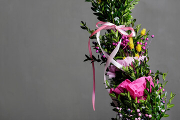 Big Easter palm with buxus on dark background.