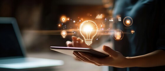 Tablet, digital interface and innovative ideas displayed with light bulb icon for brainstorming, creativity and technology solutions in modern workspace environment.
