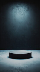 minimalist black background with solid circular platform illuminated by soft light, creating dramatic and elegant atmosphere. Ideal for showcasing products or presentations