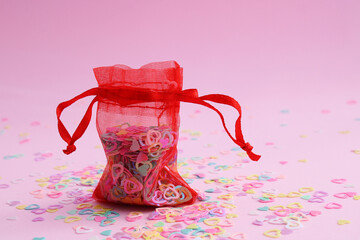 Transparent bag full of colorful hearts