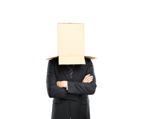 Businessman in a suit wearing a cardboard box on his head, arms crossed, isolated on a white...