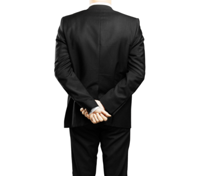 Rear view of a man in a formal suit standing with hands clasped behind his back, against an isolated white background. Concept of professionalism - Powered by Adobe