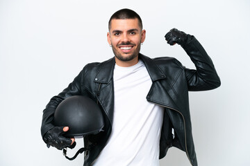 Young caucasian man with a motorcycle helmet isolated on white background doing strong gesture