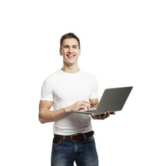 Cheerful young man in casual white shirt and jeans holding a laptop, isolated on white background. Concept of technology and positivity