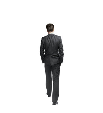 a man dressed in all black is walking A Man in Black Suit Walking on the Sidewalk Free Stock Photo