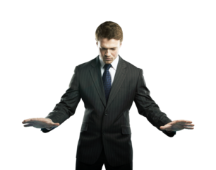 Businessman in formal suit extending hands in control gesture on isolated white background. Expression of focus and decision-making