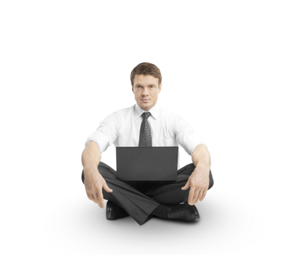 Businessman in formal attire sitting cross-legged on a white background working on a laptop. Minimalistic and professional concept