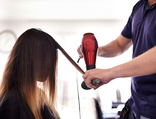 Hair care, dryer and hairdresser with woman in salon for volume, protein and deep conditioning treatment. Cosmetic, equipment and stylist with female client for blow out hairstyle in beauty parlor.