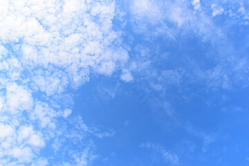 beautiful blue sky and white fluffy group of clouds with sunrise in the morning, natural background