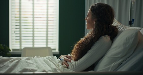 Young patient gets her knee checked by the doctor.
