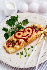 Omuraisu omelet with a smiley heart.