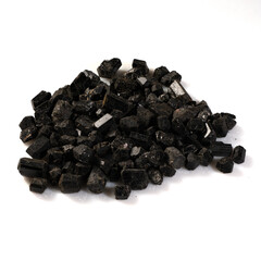 Natural Black Tourmaline Crystals Piled on White Background
