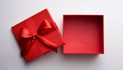 opened empty square red gift box with red ribbon on white background top view