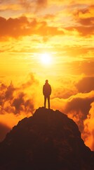 A silhouetted figure stands atop a mountain, gazing at a vibrant sunset above the clouds.
