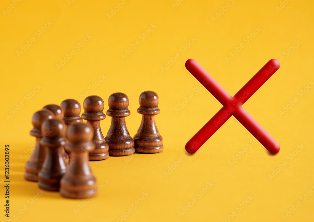 Poster chess pawns in a queue next to cross sign.