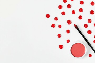 Red Lip Gloss and Brush on White Background