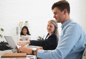Business, people and explain on laptop in meeting of planning, accounting advice and proposal...