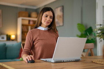 Fototapeta premium Business woman working from home. Using laptop for job