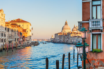 Naklejka premium Grand Canal and Basilica Santa Maria della Salute in Venice, Italy. Beautifil cityscape at sunset.