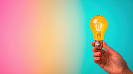 hand gently holding light bulb against colorful background, symbolizing creativity and ideas. vibrant colors evoke sense of inspiration and innovation