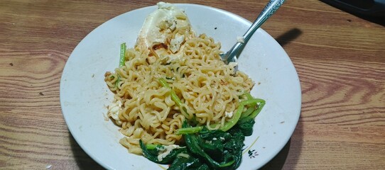 Close-up of cooked instant noodles with toppingsA detailed close-up of cooked instant noodles with toppings, showing texture and ingredients, perfect for food-related projects.