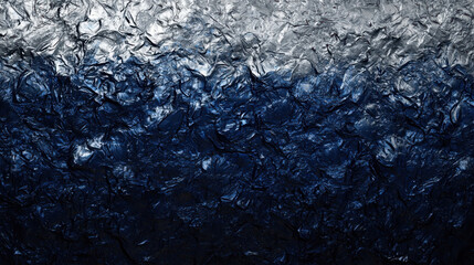 Obraz premium Abstract dark blue crystalline surface with rough textures and shimmering highlights