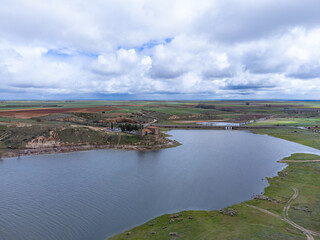 Obraz premium aerial photo of the hermitage of the Virgin of the Castle and the Ricobayo reservoir in Montamarta (Zamora). Spain