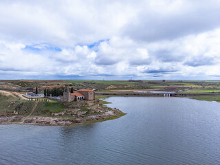 Fototapeta premium aerial photo of the hermitage of the Virgin of the Castle and the Ricobayo reservoir in Montamarta (Zamora). Spain