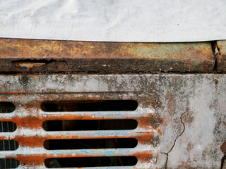 Old cars with cracked paint and rust