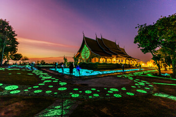 Background of the tourist attraction Wat Sirindhorn Wararam or the famous glowing temple in...