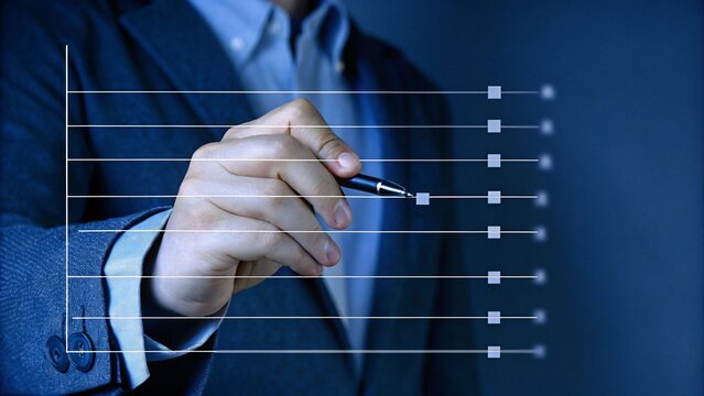 Businessman Analyzing Data with Pen to Drive Insights on Scatter Plot Chart Emphasizing Business Innovation Strategies and Trends