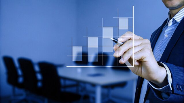 Businessman showcasing analytical insights through a boxplot chart to drive strategic decisions and foster business innovation.