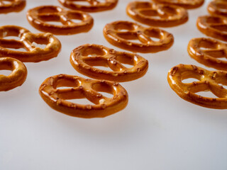 Set salted pretzels, party snacks isolated on white, top view