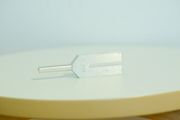tuning fork on a fabric.