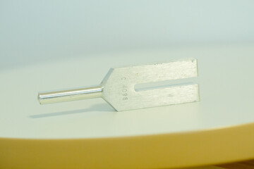 tuning fork on a fabric.