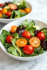 Two bowls of garden salad with fresh lettuce, tomatoes, and a dressing on the side, garnishing a healthy and refreshing meal.