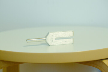 tuning fork on a fabric.