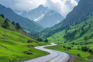 Scenic winding road through lush green hills and majestic mountains under cloudy sky