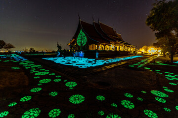 Background of the tourist attraction Wat Sirindhorn Wararam or the famous glowing temple in...