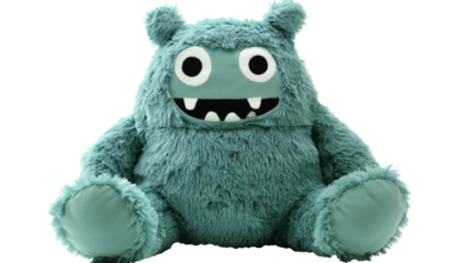 Ugly cute monster plush toy sitting on transparent background