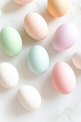 A collection of pastel-colored Easter eggs set on a clean and uncluttered white surface, creating a serene backdrop for spring festivities and seasonal decorations